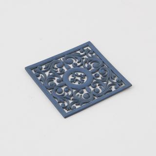 Blue Parkesine plaque with carved designs