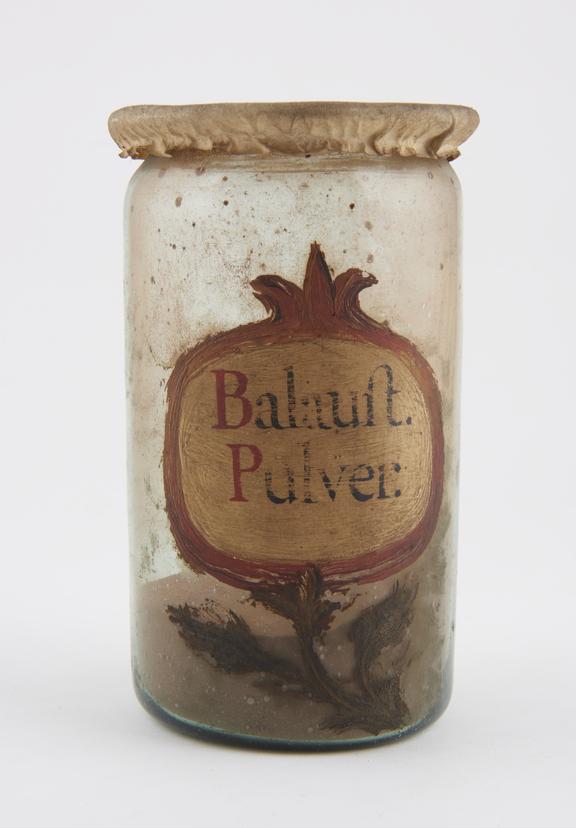 Glass drug jar, cylindrical, with parchment cover, labelled