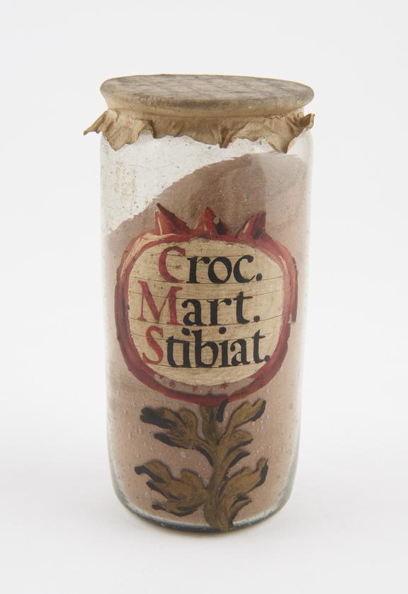 Glass drug jar, cylindrical, with parchment cover
