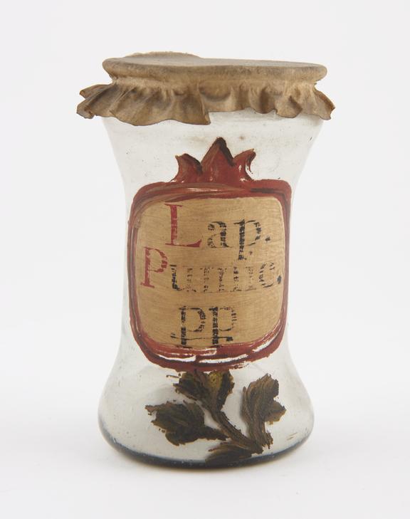 Glass albarello, with vellum cover, labelled Lap.Pumic