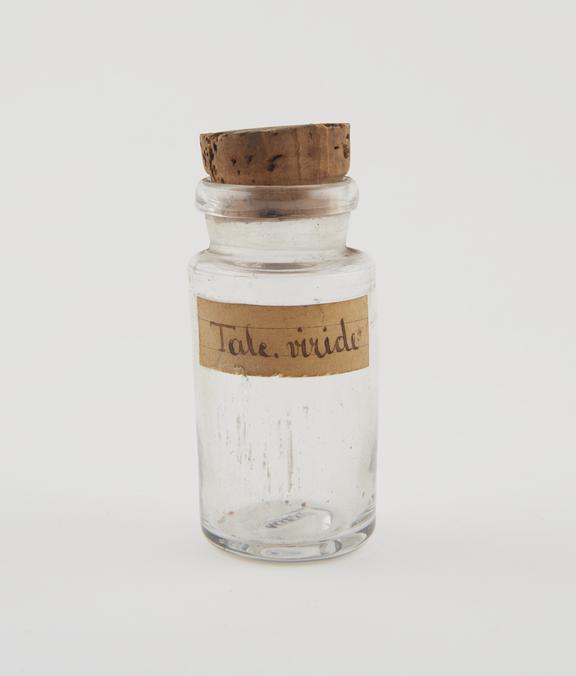 Clear glass shop round for green talcum powder