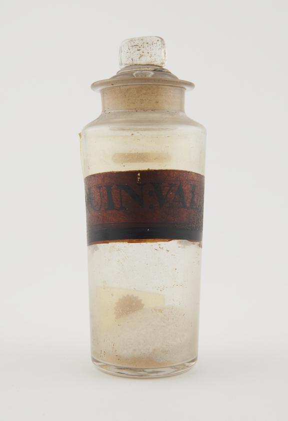 Bottle, clear glass, with contents, for quinine valerate