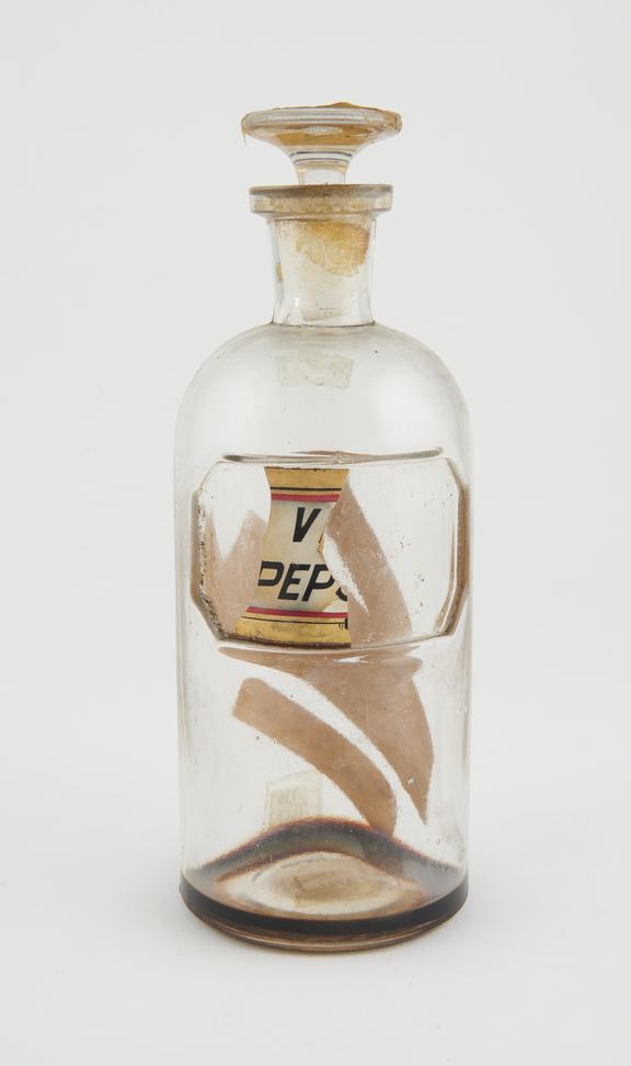 Bottle, clear glass, trace contents, for wine of pepsin, U.S.A