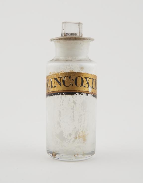 Bottle, clear glass, with contents, for zinc ocide, English