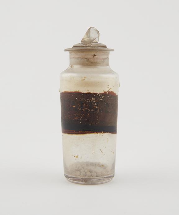 Bottle, clear glass, with contents, for calomel pills, English