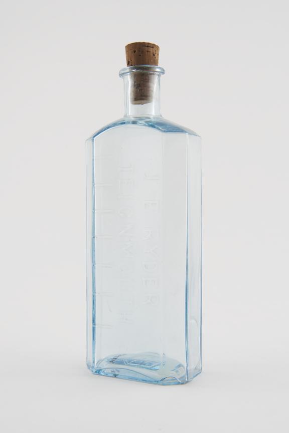 Glass dispensing bottle, from Nicholson's chemist shop, by J.E