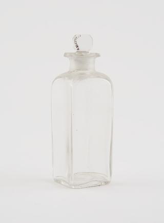 One clear glass dispensing bottle