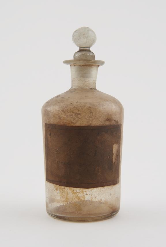 Glass dispensing bottle, with illegible inscription