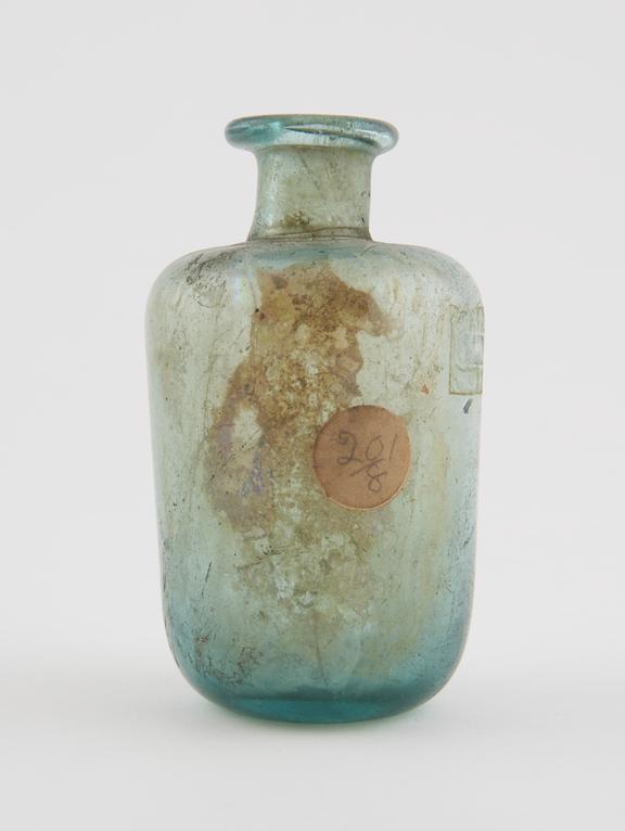 Glass bottle, cylindrical, heavy green glass, slightly weathered