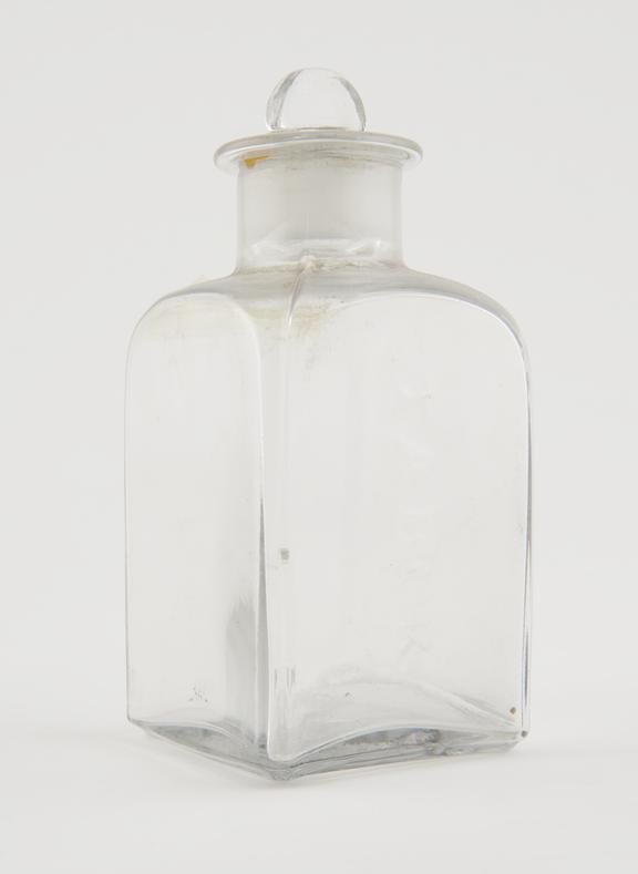 Square storage bottle, clear glass, empty, possibly English