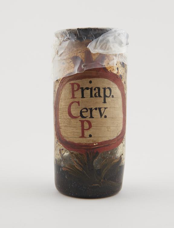 Glass drug jar, cylindrical, with parchment cover