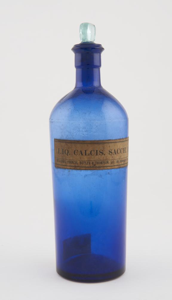 Empty bottle with glass stopper, (labelled LIQ. CALCIS. SACCH