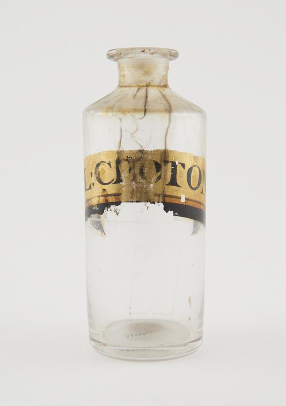 Bottle, clear glass, empty, for croton oil, English