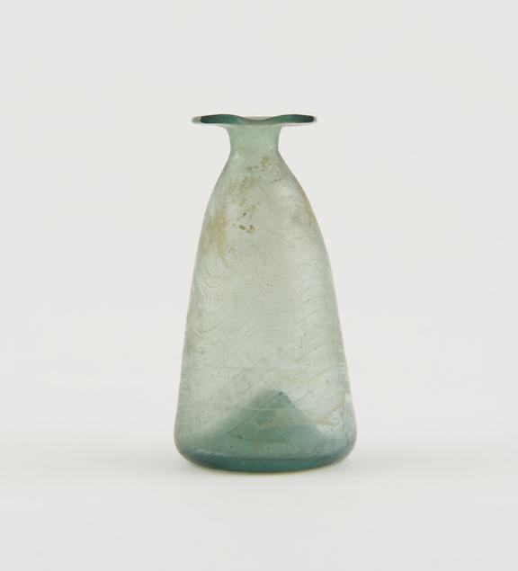 Conical iridescent green glass bottle