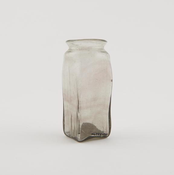 Clear glass bottle, square in section wide circular neck