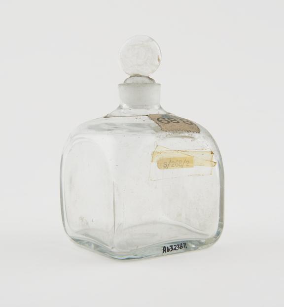 Square medicine bottle with ground glass stopper, probably