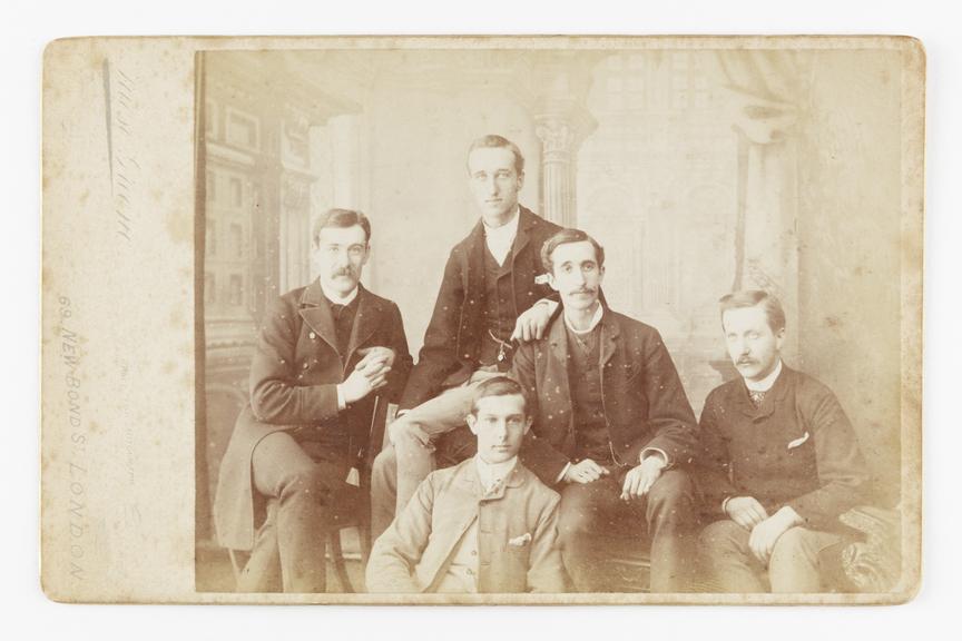 Cabinet card featuring a group portrait of William