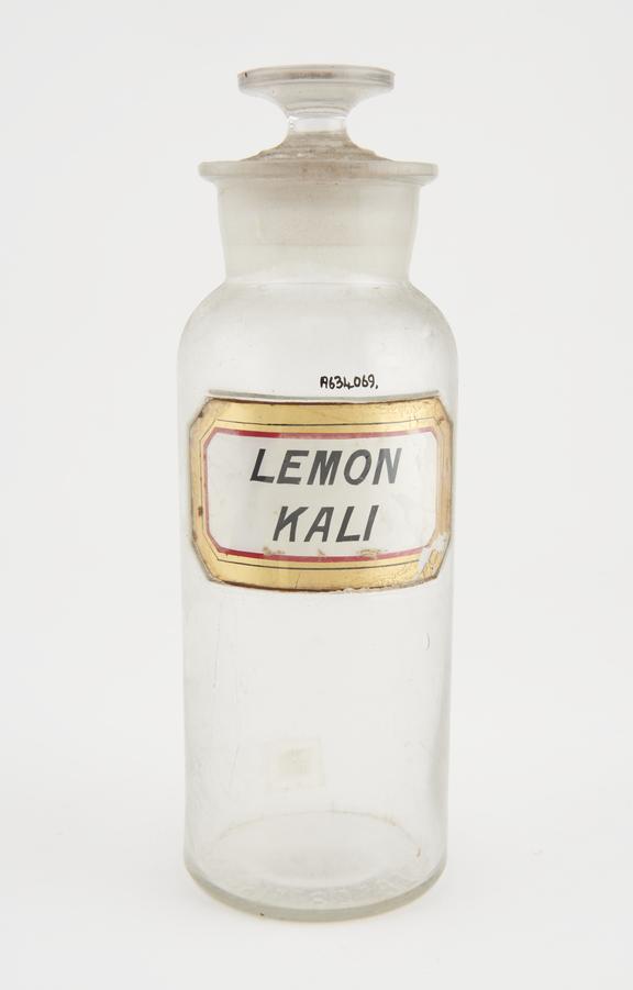 Bottle, clear glass, trace contents, for lemon kali, USA