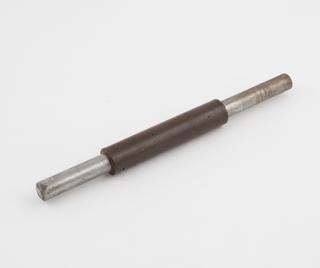 Metal rod with covering of phenolic resinoid bonded paper