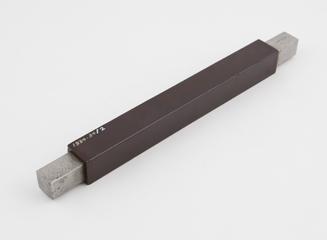 Metal rod with covering of phenolic resinoid bonded paper