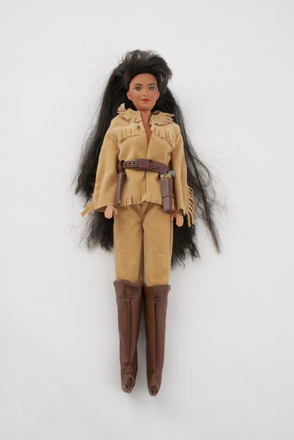 Barbie in cowboy suit,brown boots, gun and holster.