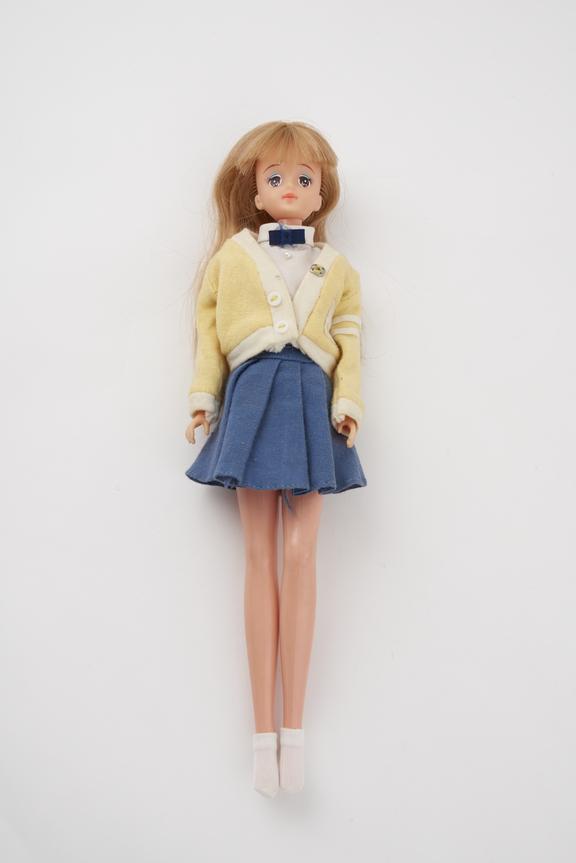 White Barbie with blue skirt, white blouse, bow tie