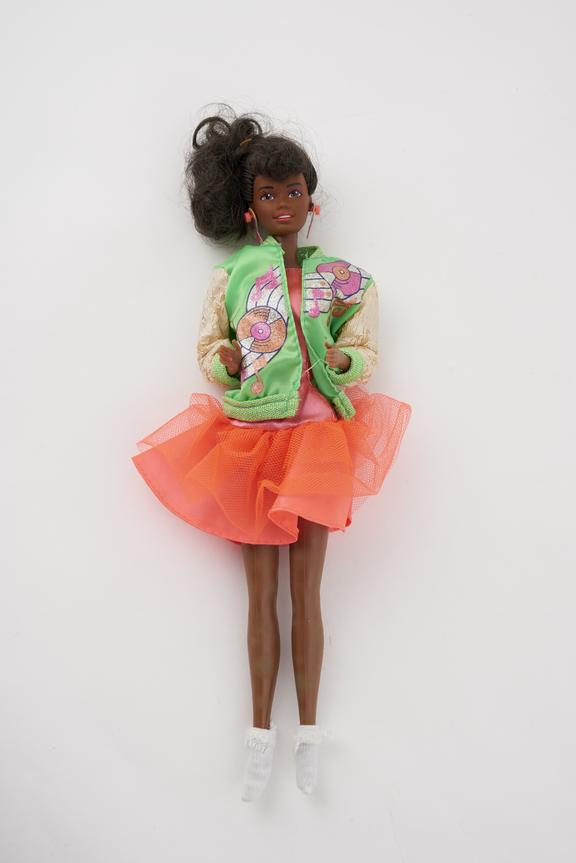 Black Barbie in red dress, white blouse