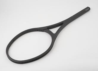 Injection moulded carbon fibre reinforced nylon tennis racket