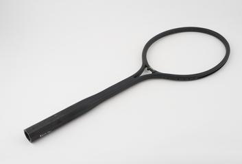 Injection moulded carbon fibre reinforced nylon tennis racket