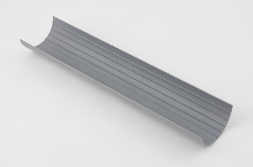 A section of grey PVC guttering, 1985