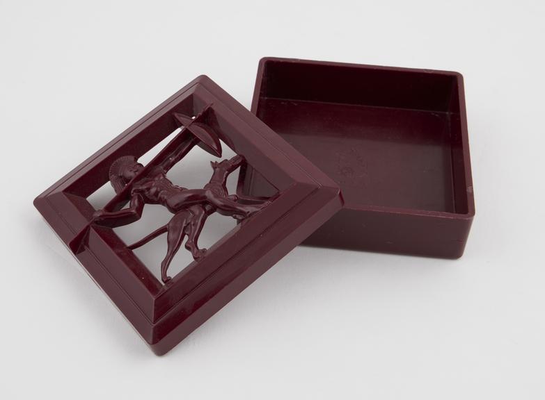 Square box of burgundy plastic