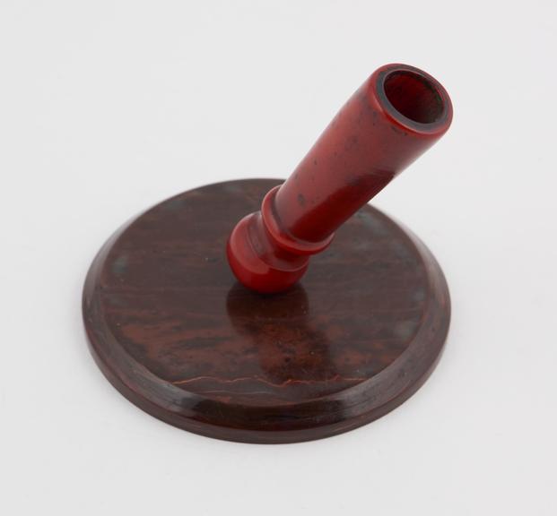 Desk pen holder of mottled red/brown phenolic