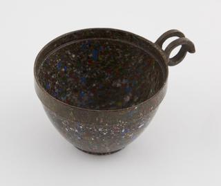 One cup from set of stacking cups and saucers