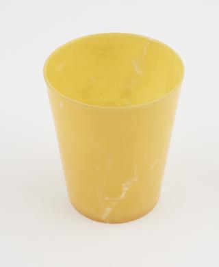 Circular beaker of pale yellow Linga Ware urea formaldehyde plastic