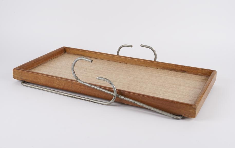 Wooden tray-like bed table with 2 pairs of metal hooks to fit