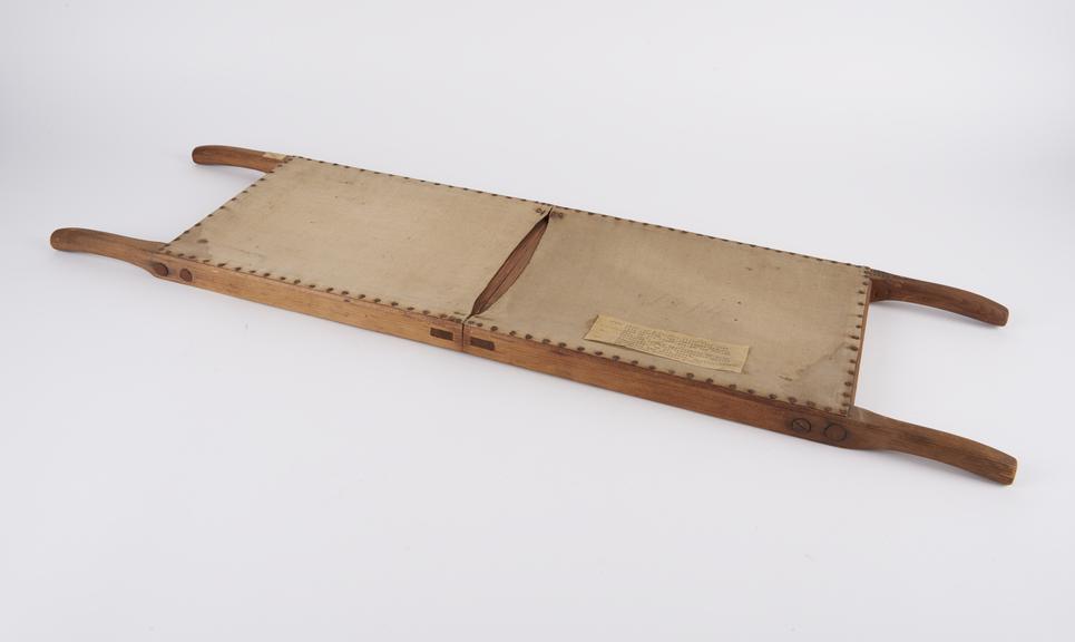 Model of folding stretcher, pine and canvas with metal fittings