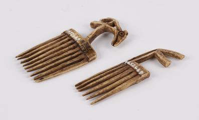 Ivory comb surmounted by zoomorphic carving