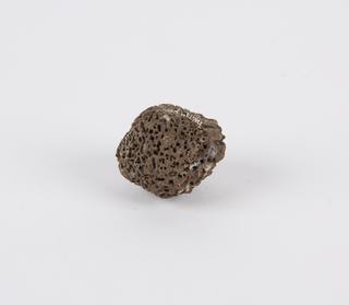 Dried nut, honeycomb appearance, roughly ball shaped