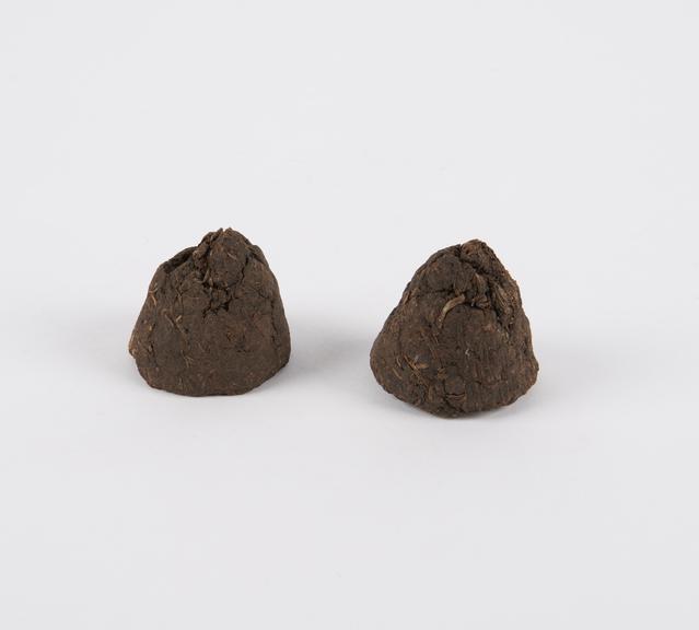 Two cone-shaped tobacco cakes, Congolese, 1890-1926