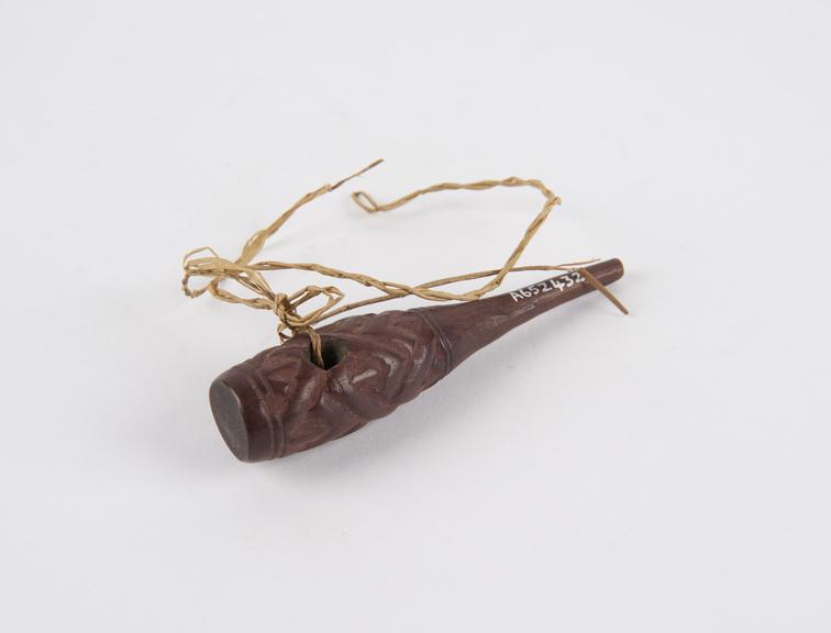 Carved wooden amulet, bottle-shaped, worn by medicine man