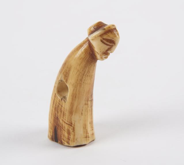 Small ivory figure made from a tusk tip with human head carved