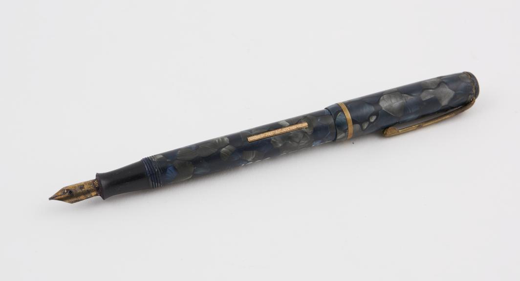 Vulcanite fountain pen in variegated blue and grey with brass