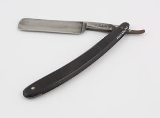 Cut throat razor with plain handle of black cellulose nitrate