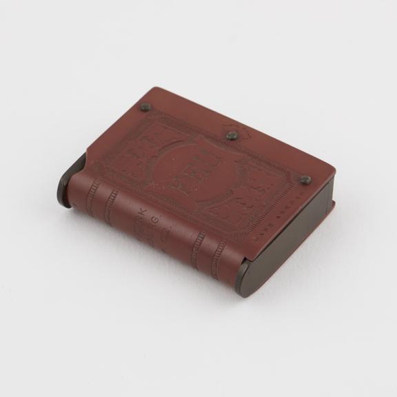 Rectangular Vesta match box of red vulcanite with brown hinged