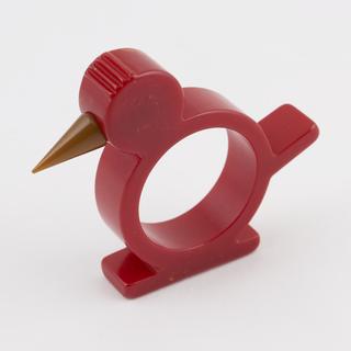 Red cast phenolic resin napkin ring moulded in the form of a bird
