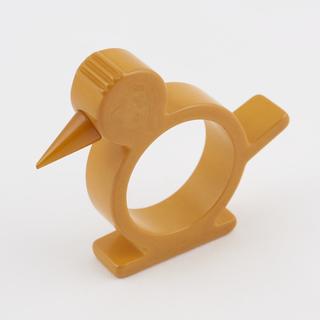 Yellow cast phenolic resin napkin ring moulded in the form of a bird