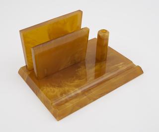 Square letter rack with two trapezoidal uprights to hold letters