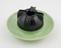 Globular ashtray of black phenolic screwed to green marbled