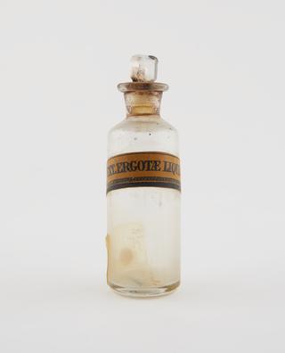 Shop round, inscribed "EXt. Ergotae Liquid"