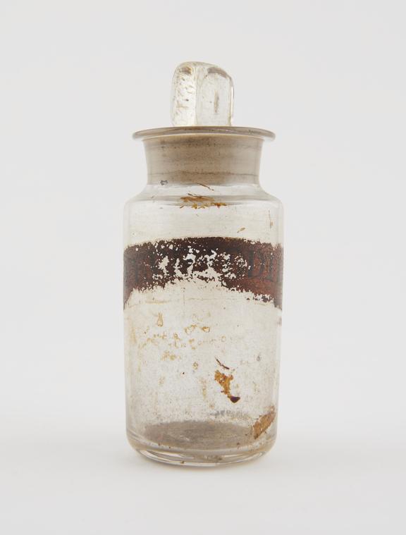 Bottle, clear glass, trace contents, for ferrous iodide